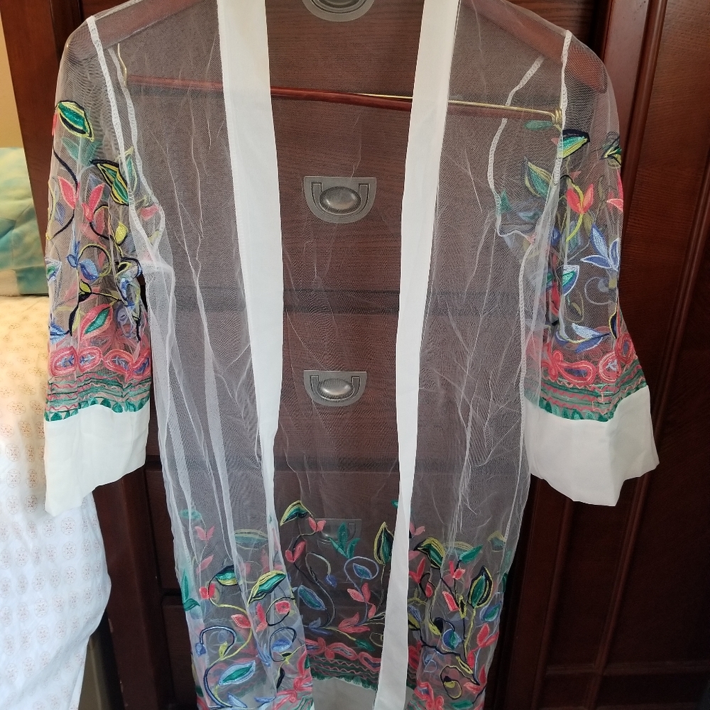 Beautiful embroidered cover up.